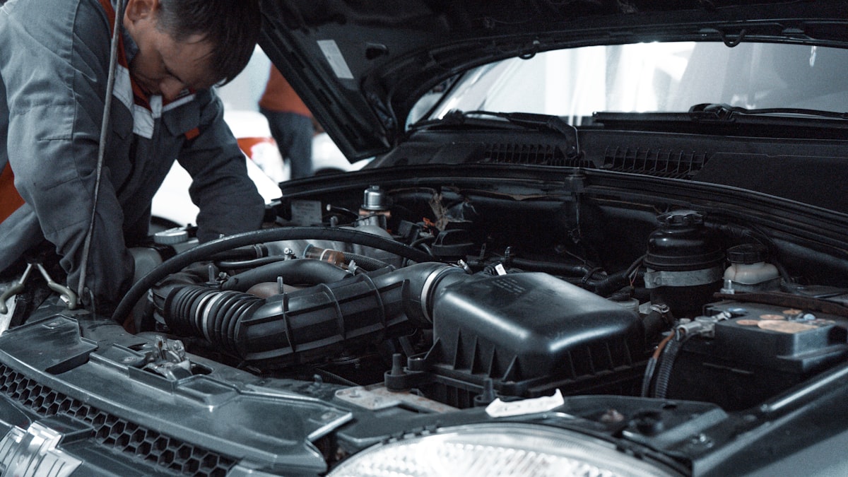 Mechanic inspecting the engine