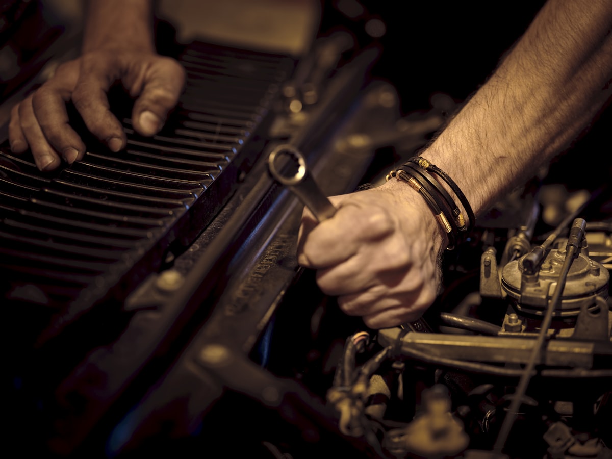 Hands working with a wrench