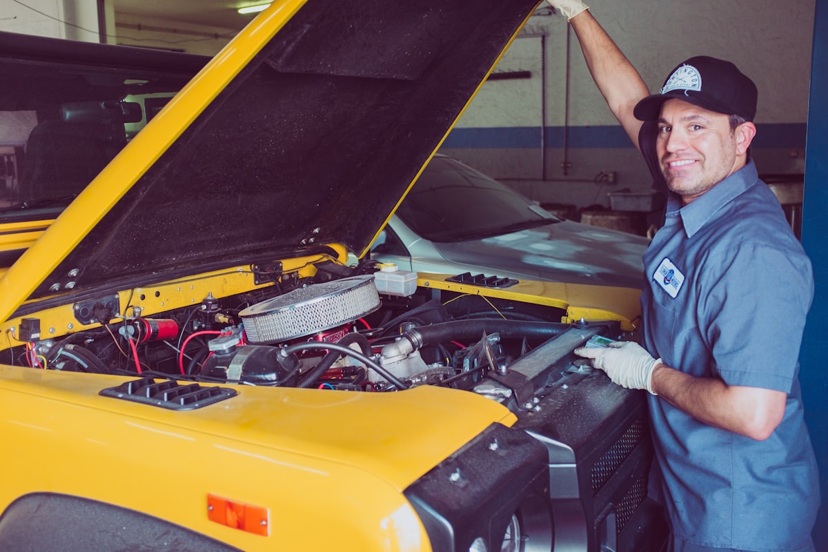 Mechanic with a customer's vehicle